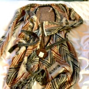 NWT wrap around patterned asymmetrical fringed bottom